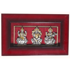Framed Silver and Gold-Toned Idols of Lakshmi, Ganesha, and Saraswati